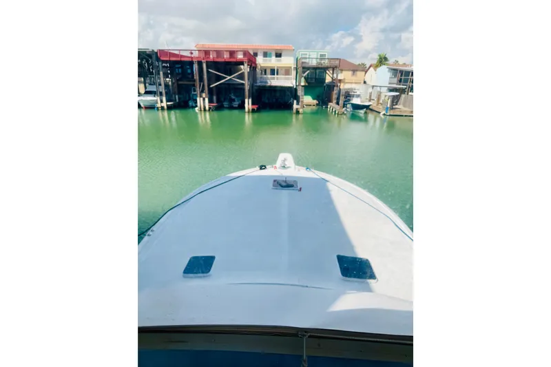 All In Yacht Photos Pics Bow view of 1993 Viking 50 Convertible yacht docked in a marina.