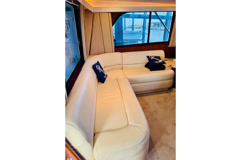 All In Yacht Photos Pics Luxurious interior of 1993 Viking 50 Convertible yacht with cream leather seating.