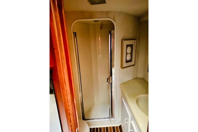 All In Yacht Photos Pics Bathroom interior of 1993 Viking 50 Convertible yacht with shower and sink.