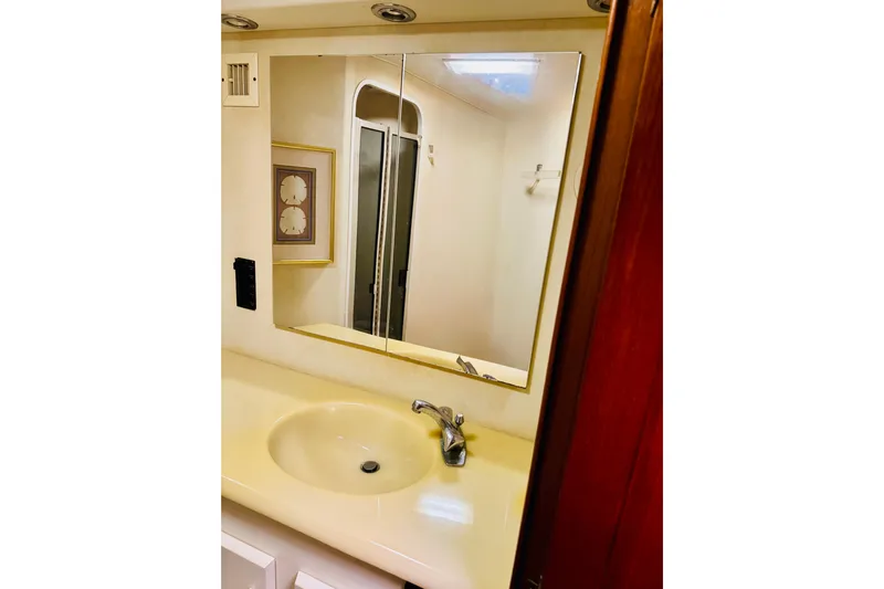 All In Yacht Photos Pics Bathroom vanity with mirror in 1993 Viking 50 Convertible yacht.