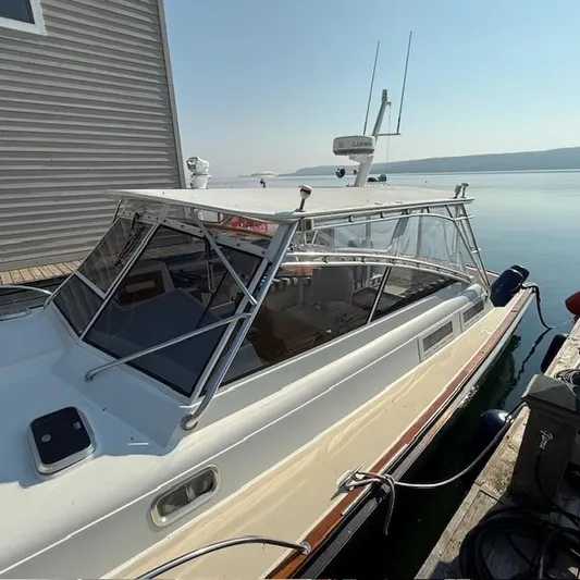  Yacht Photos Pics 1997 Little Harbor WhisperJet 46 docked by a calm waterfront.