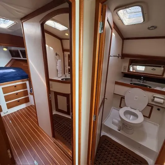  Yacht Photos Pics Interior of 1997 Little Harbor WhisperJet 46 yacht, featuring a cozy cabin and bathroom.