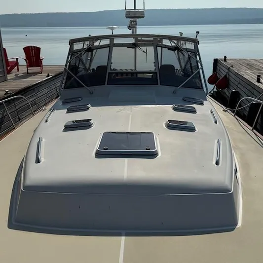  Yacht Photos Pics 1997 Little Harbor WhisperJet 46 docked by a serene lake.