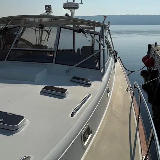  Yacht Photos Pics 1997 Little Harbor WhisperJet 46 yacht docked by calm waters.