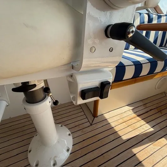  Yacht Photos Pics Close-up of 1997 Little Harbor WhisperJet 46 interior, featuring striped seating and wooden flooring.