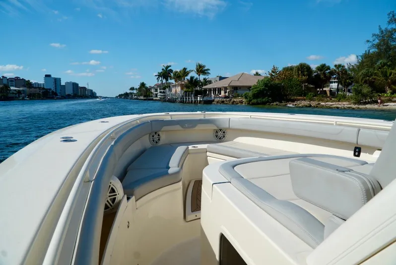 Af1 Yacht Photos Pics 2019 Scout 355 LXF boat cruising on a scenic waterway with clear skies.