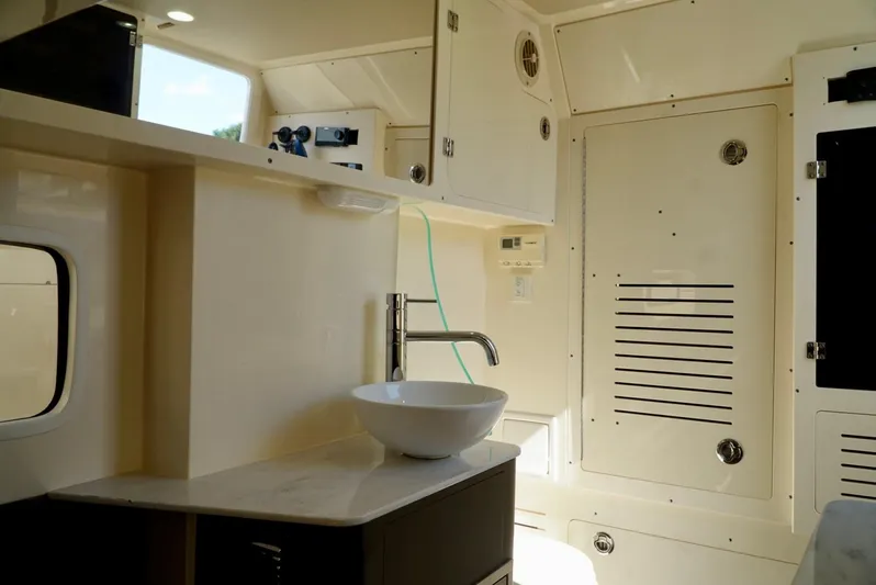 Af1 Yacht Photos Pics 2019 Scout 355 LXF boat interior with modern sink and cabinetry.