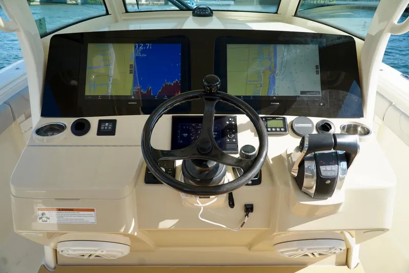 Af1 Yacht Photos Pics 2019 Scout 355 LXF boat dashboard with dual displays and steering wheel.