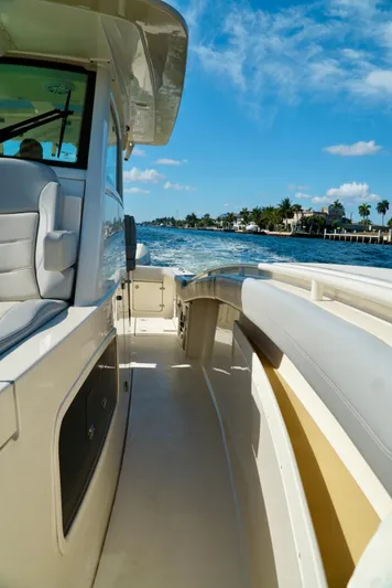 Af1 Yacht Photos Pics 2019 Scout 355 LXF boat cruising on a sunny day with clear blue skies.