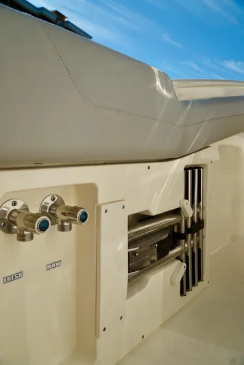 Af1 Yacht Photos Pics 2019 Scout 355 LXF boat interior with water controls and storage compartments.