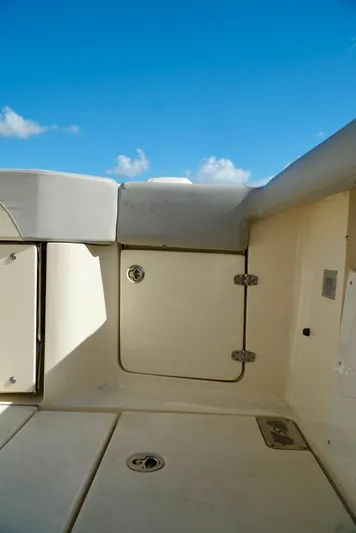 Af1 Yacht Photos Pics 2019 Scout 355 LXF boat interior with storage compartment under clear blue sky.