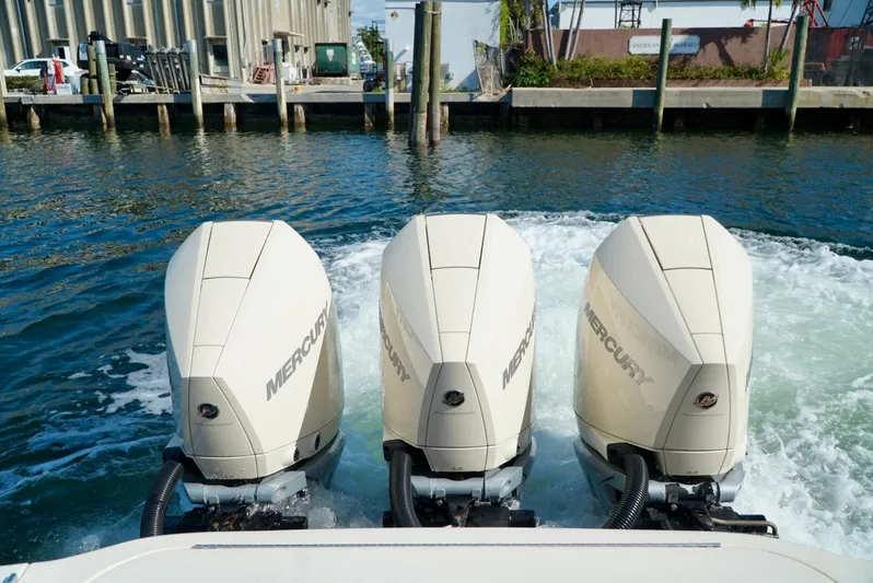 Af1 Yacht Photos Pics Triple Mercury outboard engines on a 2019 Scout 355 LXF boat in a marina.