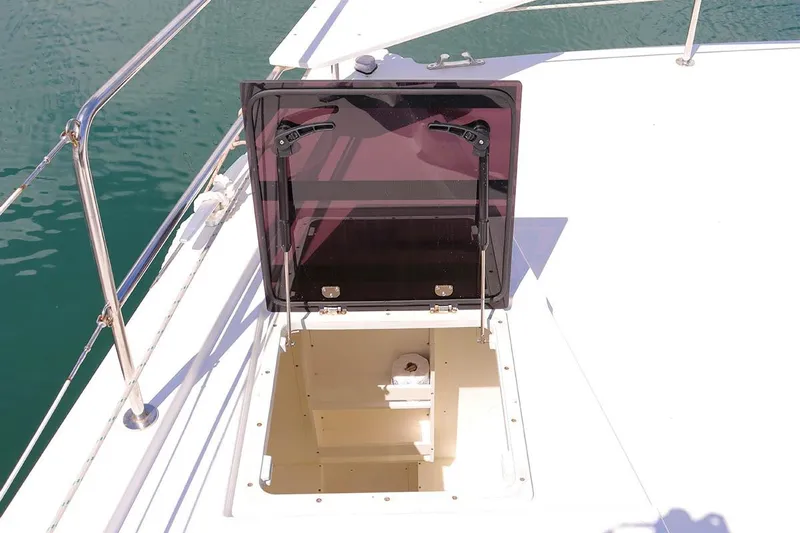 Fortunate Sun Yacht Photos Pics Open hatch on 2022 Bali 4.6 yacht deck, revealing storage compartment.