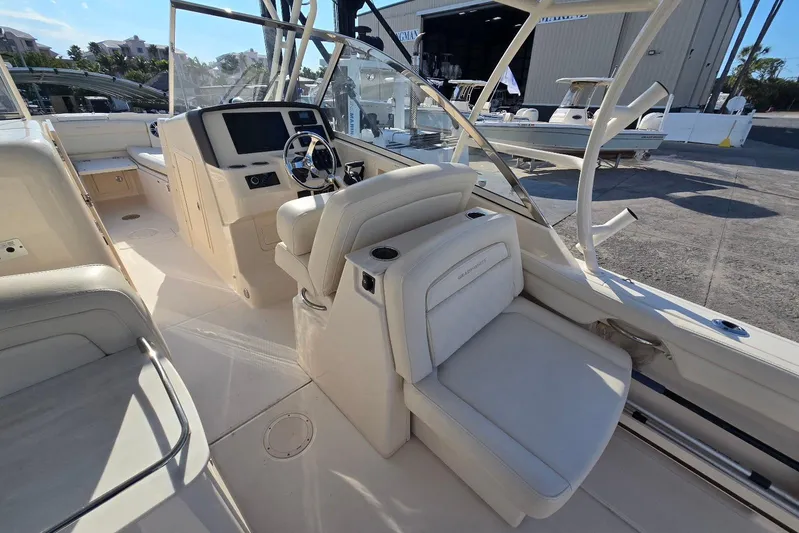 Yacht Photos Pics 2022 Grady-White Freedom 285 boat interior with helm and seating area.