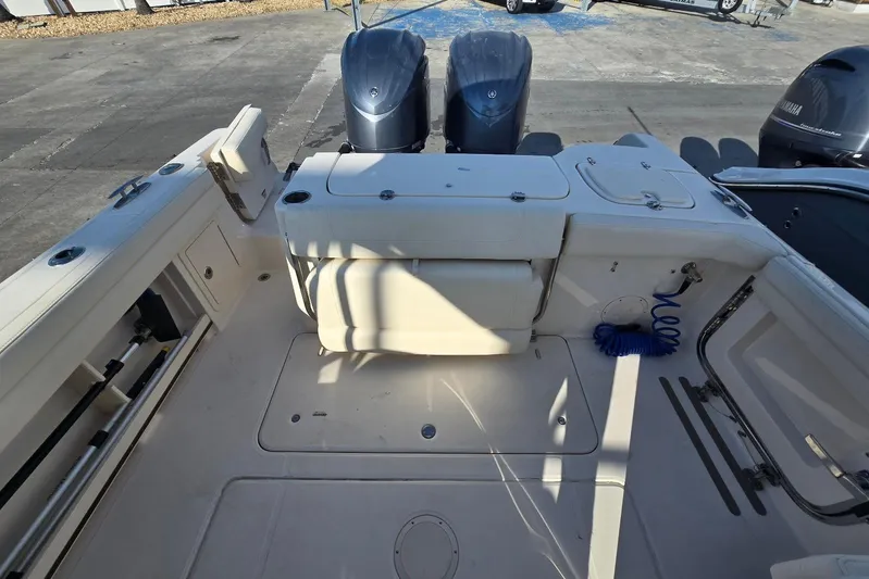  Yacht Photos Pics 2022 Grady-White Freedom 285 boat interior with dual engines and spacious deck layout.