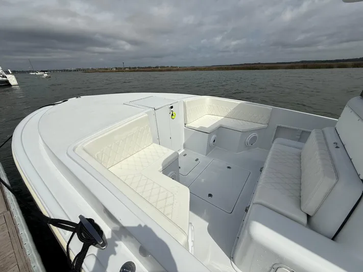  Yacht Photos Pics 2003 Strike 35 Cuddy boat with white seating, docked on a cloudy day.