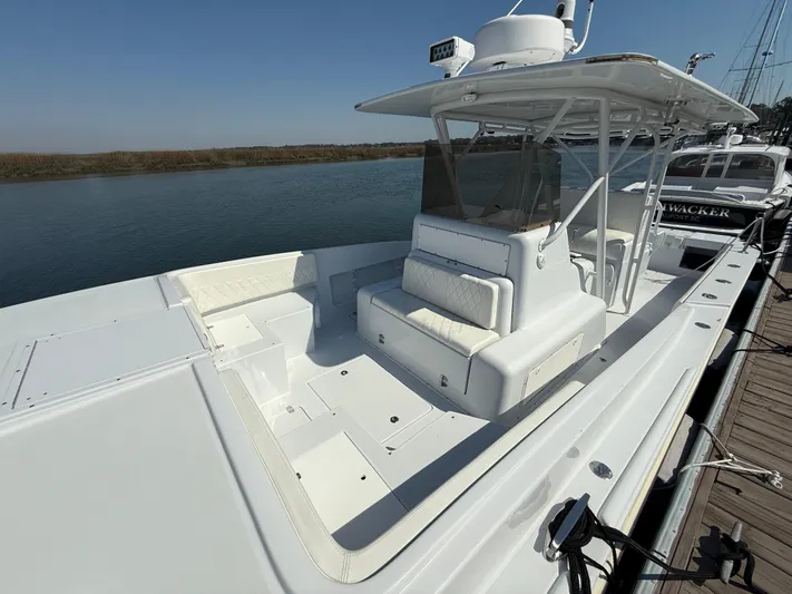  Yacht Photos Pics 2003 Strike 35 Cuddy boat docked, featuring spacious seating and sleek design.