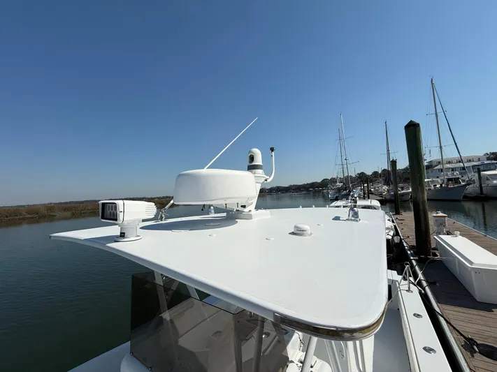  Yacht Photos Pics 2003 Strike 35 Cuddy boat docked, featuring radar and navigation equipment on the roof.