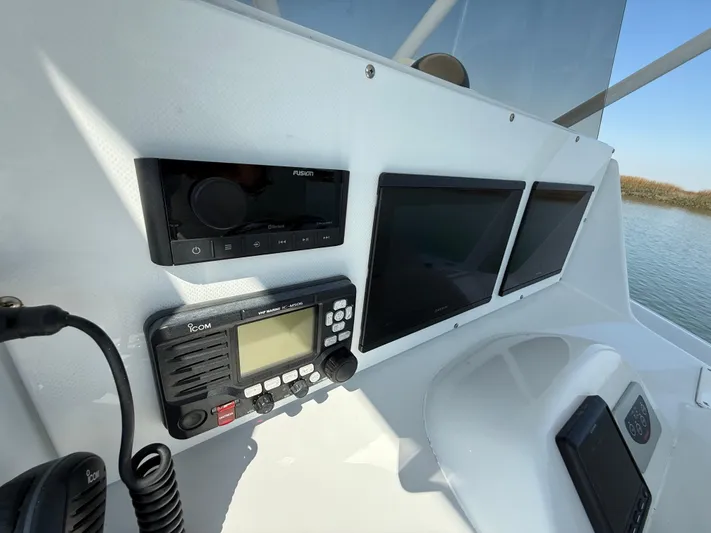  Yacht Photos Pics Control panel of 2003 Strike 35 Cuddy boat with navigation and communication equipment.