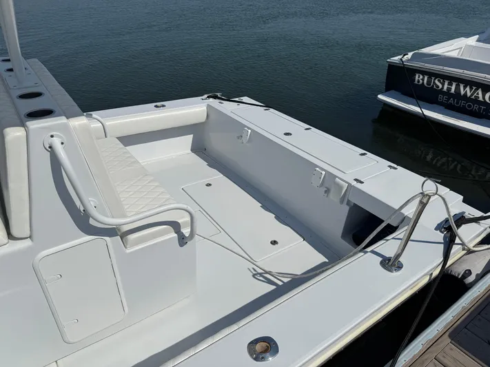  Yacht Photos Pics 2003 Strike 35 Cuddy boat with spacious deck, docked by the water.