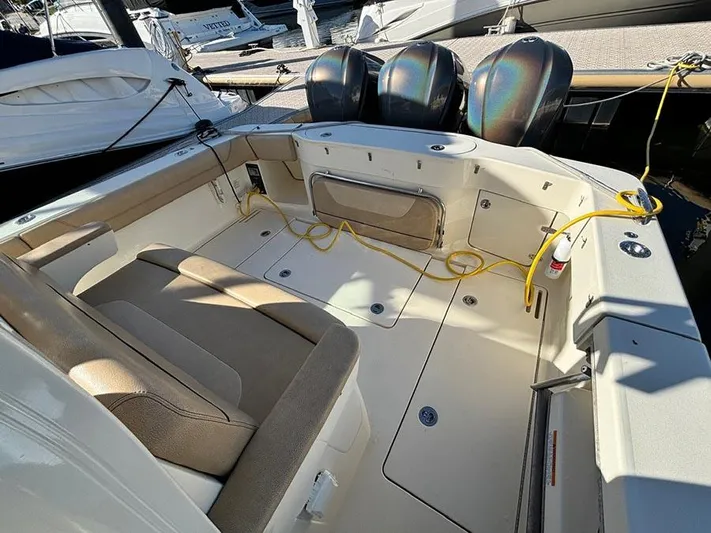  Yacht Photos Pics 2016 Scout 350 LXF boat interior with seating and triple outboard motors.