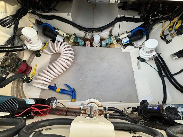  Yacht Photos Pics Engine compartment of 2016 Scout 350 LXF boat with hoses and wiring.