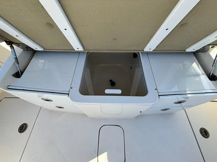  Yacht Photos Pics 2016 Scout 350 LXF boat storage compartment with open lid.