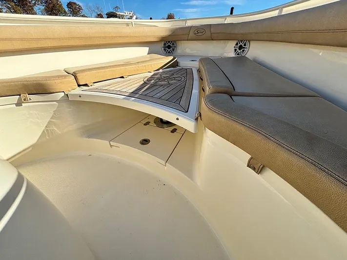  Yacht Photos Pics 2016 Scout 350 LXF boat interior with cushioned seating and deck.