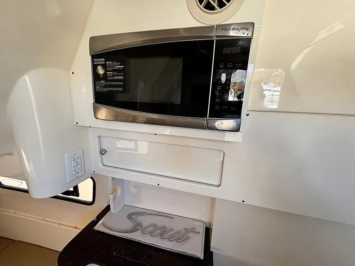  Yacht Photos Pics 2016 Scout 350 LXF interior with Frigidaire microwave and branded towel.