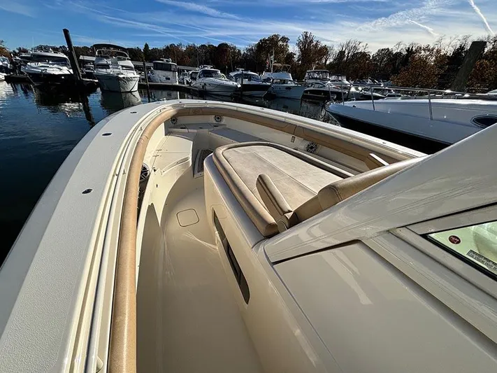  Yacht Photos Pics 2016 Scout 350 LXF boat docked in a marina with other vessels.
