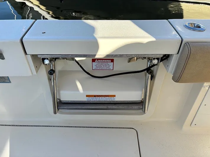  Yacht Photos Pics 2016 Scout 350 LXF boat swim platform with ladder and warning label.