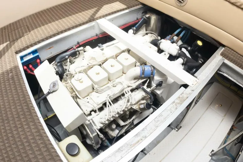 Adventures Await Yacht Photos Pics Engine compartment of 2004 Meridian 490 Pilothouse yacht, showcasing detailed mechanical components.