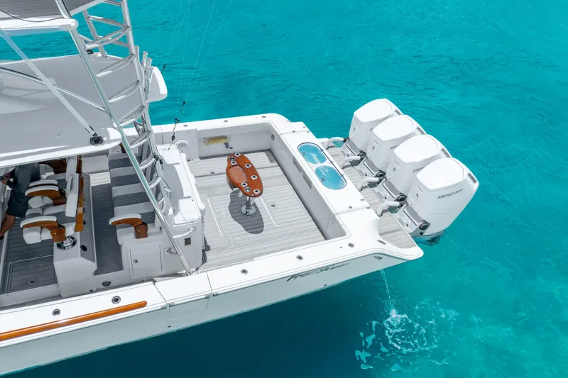  Yacht Photos Pics 2023 Front Runner 47 Center Console boat with quad outboard engines on turquoise water.