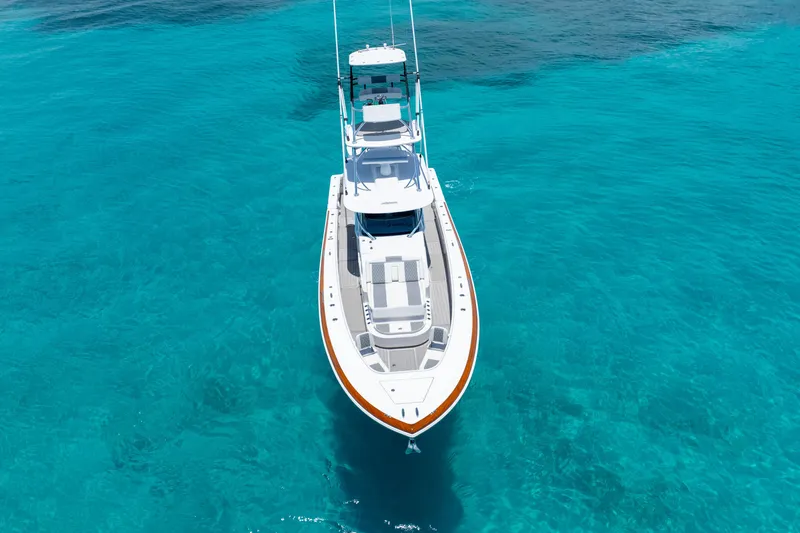  Yacht Photos Pics 2023 Front Runner 47 Center Console boat on clear turquoise water.