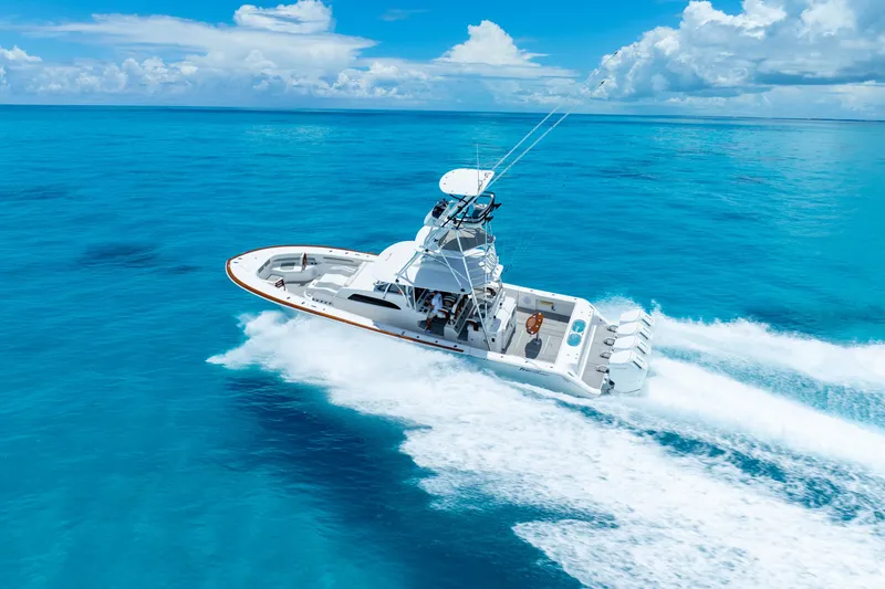  Yacht Photos Pics 2023 Front Runner 47 Center Console boat cruising on clear blue ocean.