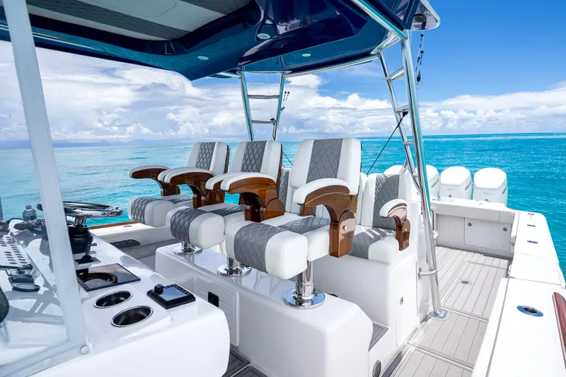  Yacht Photos Pics 2023 Front Runner 47 Center Console boat with luxurious seating and ocean backdrop.
