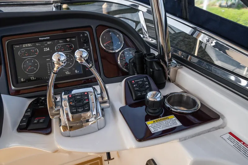 Gail’s Storm IV Yacht Photos Pics Control panel of a 2015 Meridian 441 Sedan yacht with navigation instruments and controls.