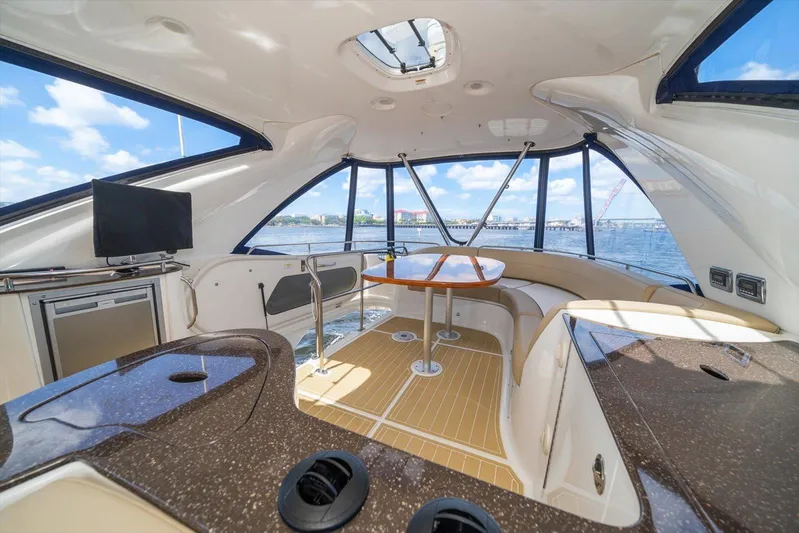 Gail’s Storm IV Yacht Photos Pics Luxurious interior of 2015 Meridian 441 Sedan yacht with panoramic windows and modern amenities.