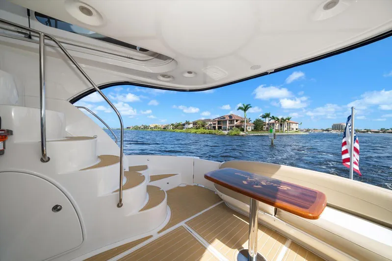 Gail’s Storm IV Yacht Photos Pics Luxurious 2015 Meridian 441 Sedan yacht with scenic waterfront view and elegant interior.