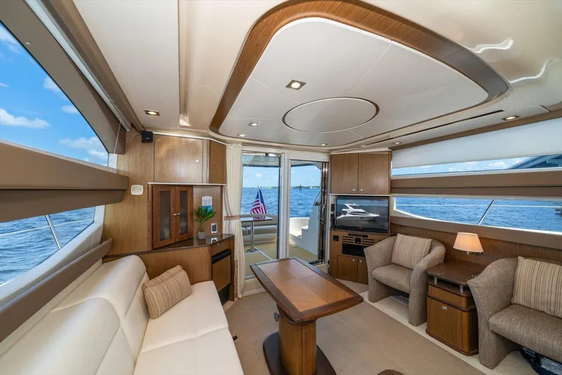 Gail’s Storm IV Yacht Photos Pics Luxurious interior of 2015 Meridian 441 Sedan yacht with elegant seating and ocean view.