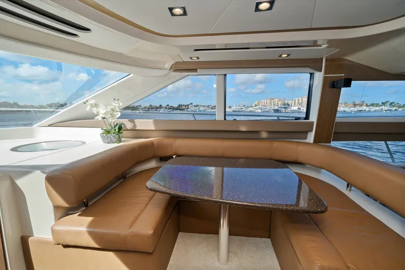 Gail’s Storm IV Yacht Photos Pics Luxurious interior of 2015 Meridian 441 Sedan yacht with elegant seating and scenic window views.