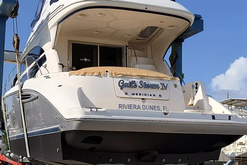 Gail’s Storm IV Yacht Photos Pics 2015 Meridian 441 Sedan yacht at Riviera Dunes, FL, docked under clear skies.