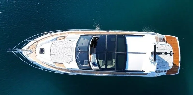 Tango Lima Yacht Photos Pics Aerial view of 2022 Sunseeker 60 Predator EVO yacht on calm water.