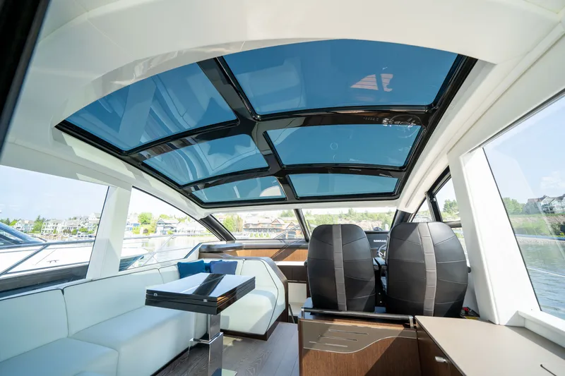 Tango Lima Yacht Photos Pics Luxurious interior of 2022 Sunseeker 60 Predator EVO yacht with panoramic glass roof.