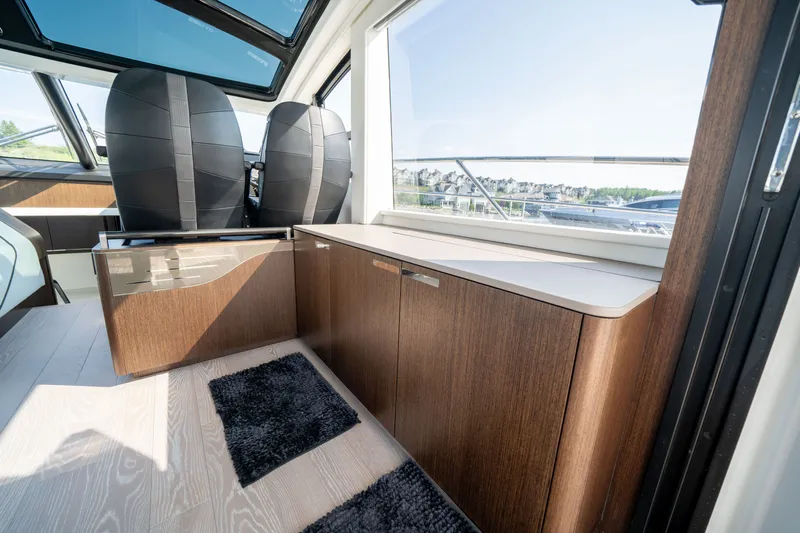 Tango Lima Yacht Photos Pics Interior of 2022 Sunseeker 60 Predator EVO yacht with sleek wood cabinetry and modern design.