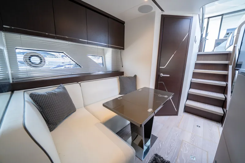Tango Lima Yacht Photos Pics Luxurious interior of 2022 Sunseeker 60 Predator EVO yacht with modern seating and sleek design.