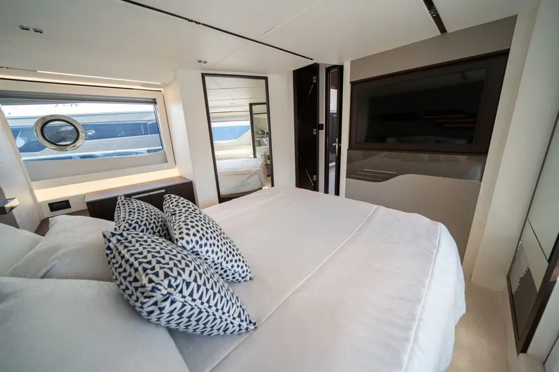 Tango Lima Yacht Photos Pics Luxurious bedroom interior of 2022 Sunseeker 60 Predator EVO yacht with modern decor.