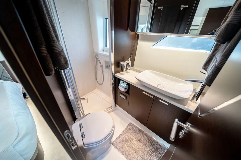 Tango Lima Yacht Photos Pics Luxurious bathroom in 2022 Sunseeker 60 Predator EVO yacht, featuring modern fixtures and elegant design.