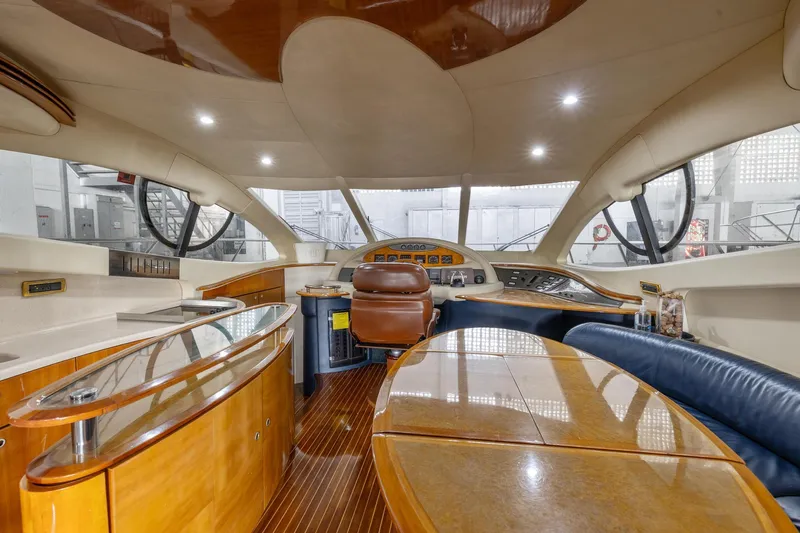 Susi Yacht Photos Pics Interior of a 2005 Azimut 55 Flybridge yacht with luxurious wood finishes.