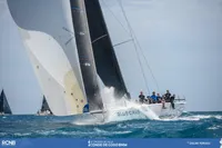 Sailing yacht TP52 racing in the ocean, crew on deck, 2007 model.